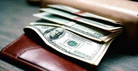 wallet with money in a table